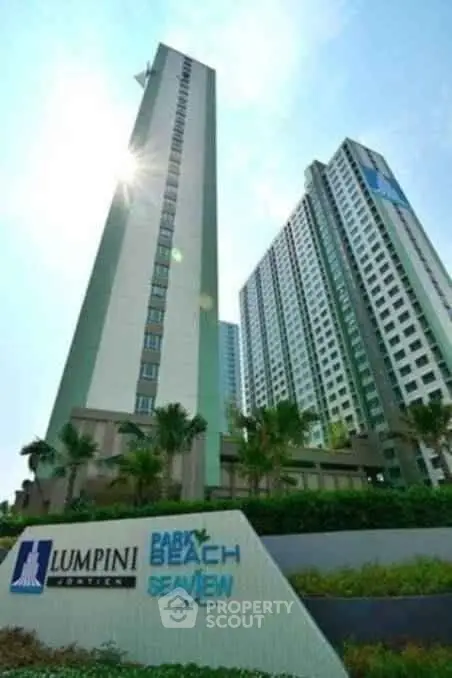 Stunning high-rise condominium with modern architecture and lush landscaping.