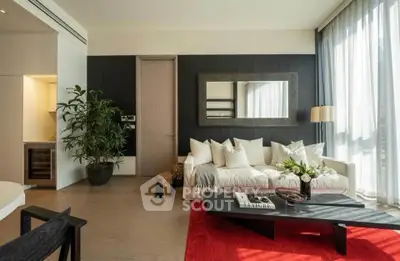 Luxurious modern living room with stylish decor and large windows