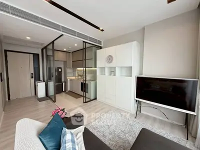 Modern living room with open kitchen and stylish decor