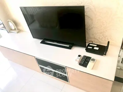 Modern living room with sleek TV setup and stylish console