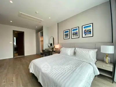 Spacious modern bedroom with elegant decor and natural light