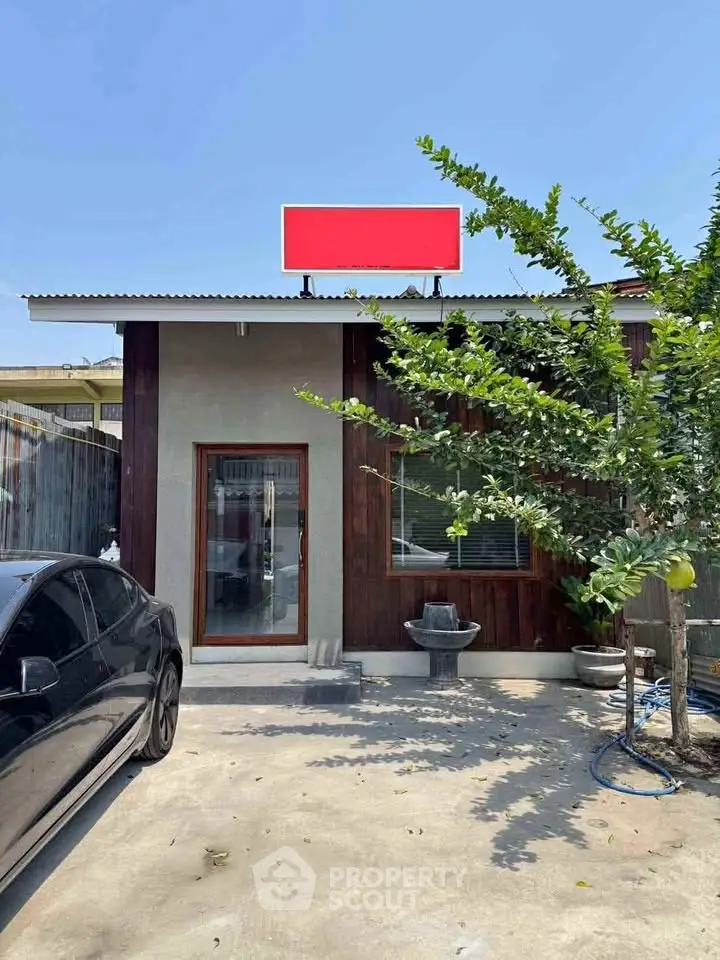 Charming modern house exterior with sleek design and spacious driveway, perfect for contemporary living.