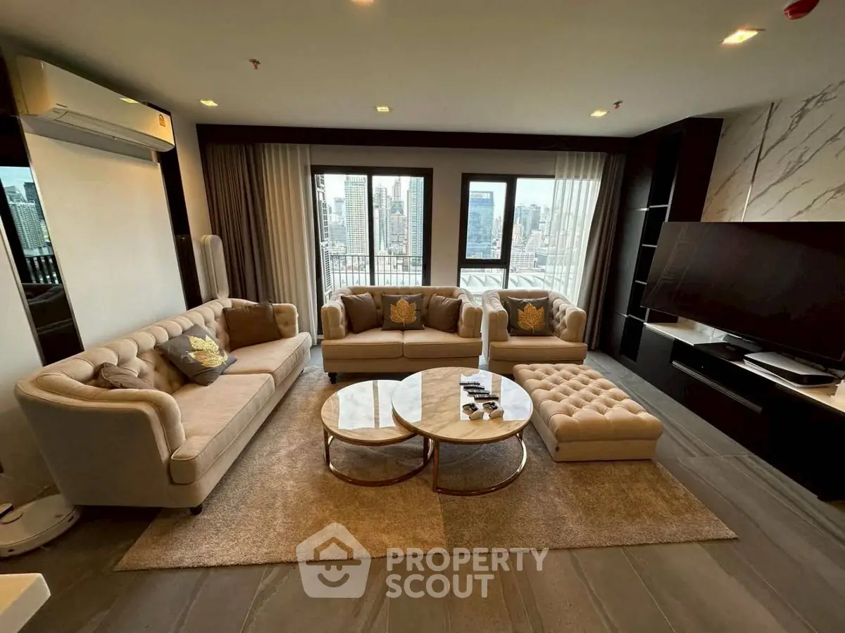 Luxurious living room with elegant sofas and city view, perfect for modern urban living.