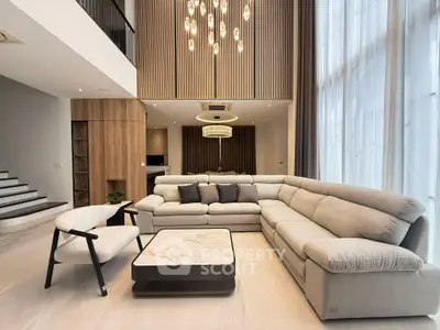 Luxurious modern living room with elegant sectional sofa and chic lighting
