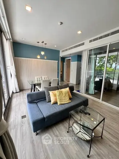 Modern living room with stylish decor and large windows for natural light