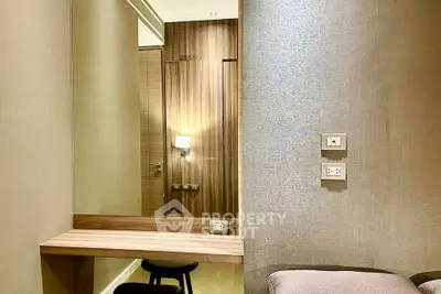 Modern bedroom with elegant wood paneling and built-in vanity desk