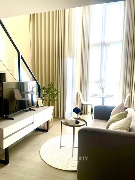 Modern living room with high ceilings and elegant decor