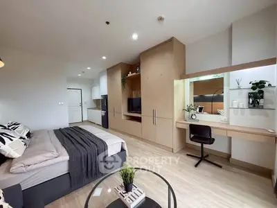 Modern studio apartment with stylish decor and built-in storage solutions