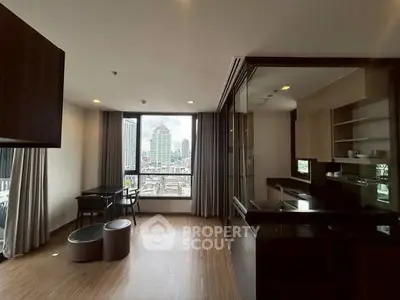 Spacious modern living room with city view and open kitchen layout