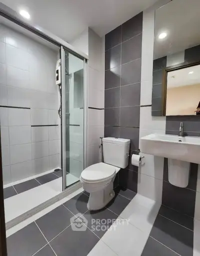 Modern bathroom with sleek shower and contemporary fixtures