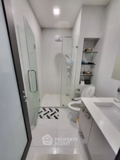 Modern bathroom with glass shower and sleek fixtures