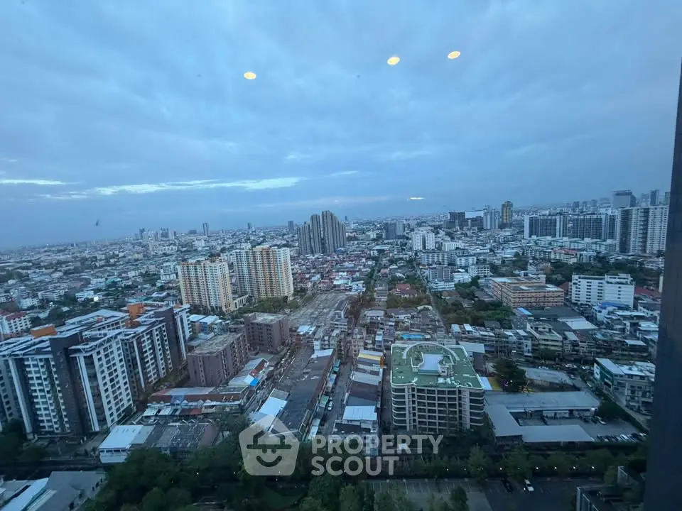 Stunning cityscape view from high-rise building showcasing urban skyline and vibrant city life.