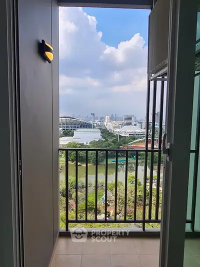 Stunning balcony view overlooking lush greenery and city skyline