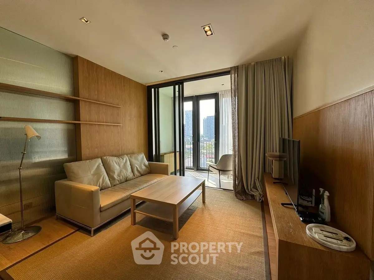 Modern living room with balcony view and stylish furniture