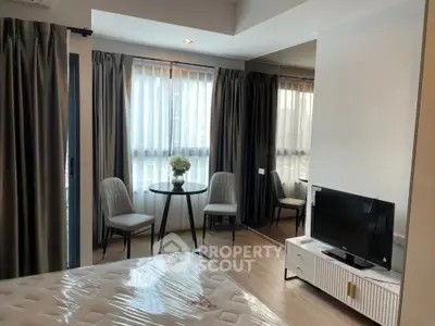 Modern bedroom with large windows and stylish furniture in a high-rise apartment