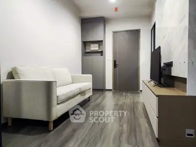 Modern living room with sleek flooring and minimalist decor