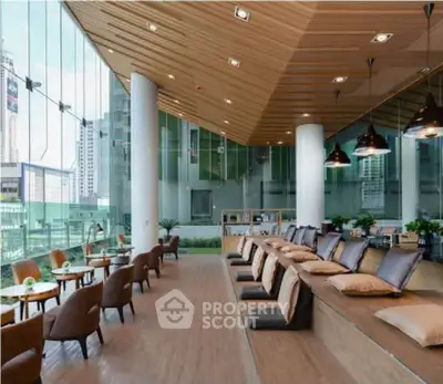 Modern co-working space with city view and stylish seating area
