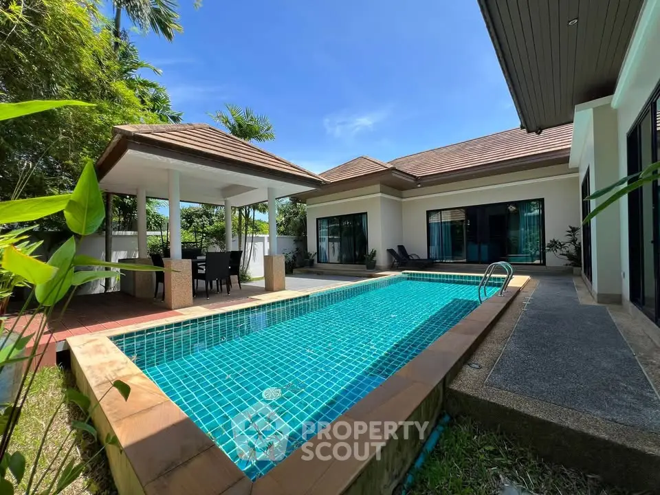Luxurious villa with private pool and outdoor dining area, perfect for tropical living.