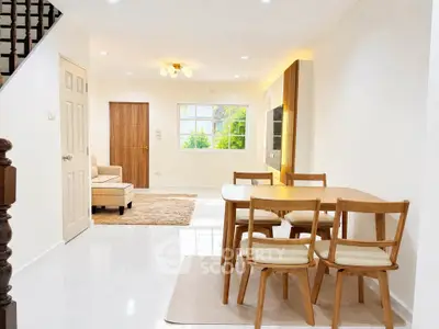 Bright and spacious living room with modern dining area and elegant decor