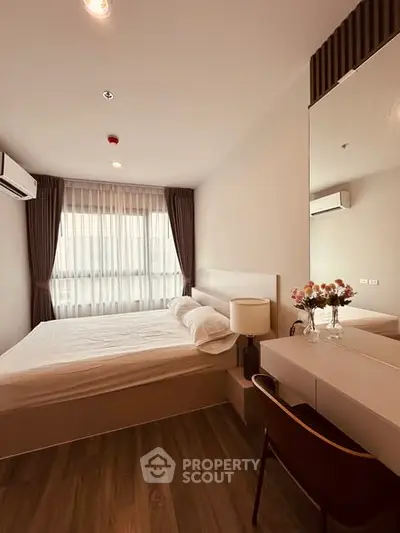 Modern bedroom with elegant decor and natural light