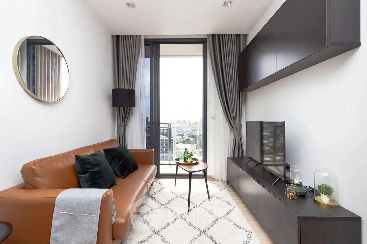 Modern living room with city view, stylish furniture, and elegant decor