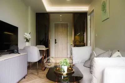 Modern living room with stylish decor and cozy seating area, perfect for relaxation and entertainment.