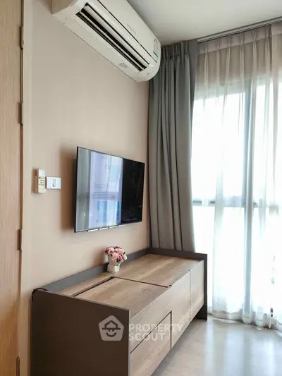 Modern living room with air conditioning and stylish furniture