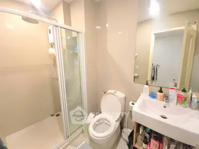 Modern bathroom with shower and sink in a real estate property