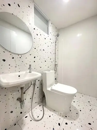 Modern bathroom with terrazzo tiles and sleek fixtures