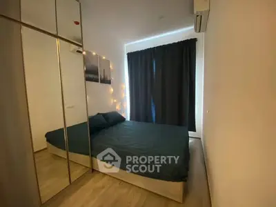 Cozy bedroom with mirrored wardrobe and ambient lighting