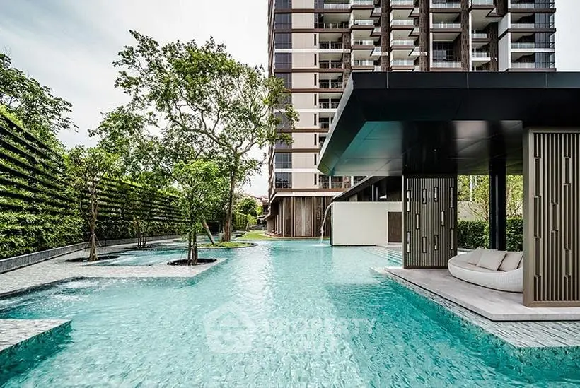 Luxurious condominium with stunning pool and modern architecture