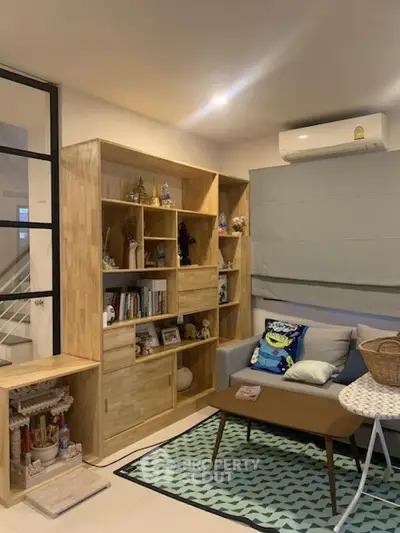 Cozy living room with modern wooden shelving and stylish decor