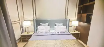 Luxurious bedroom with elegant decor and ambient lighting