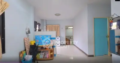 Spacious interior with light blue walls and modern decor, ideal for comfortable living.