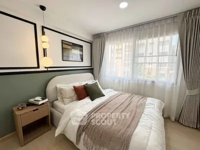 Cozy bedroom with modern decor, featuring a comfortable bed, stylish lighting, and large windows with elegant curtains.