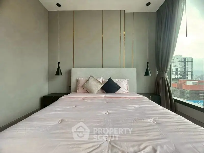 Modern bedroom with large window and stylish decor in urban apartment