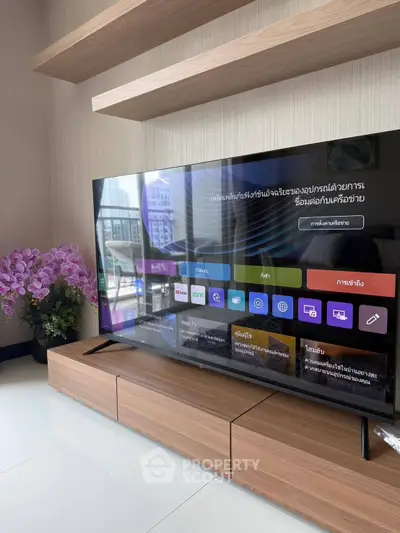 Modern living room with sleek TV unit and elegant decor