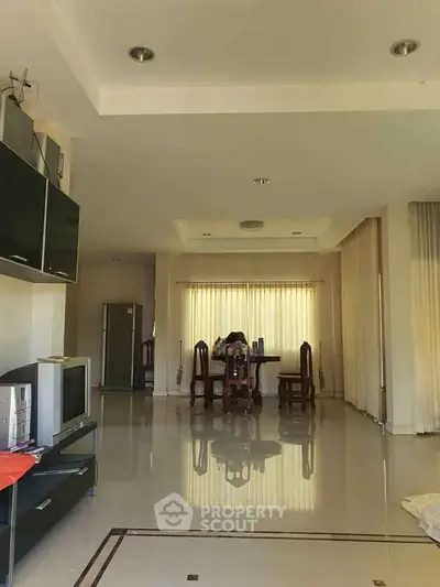 Spacious living room with elegant dining area and modern decor