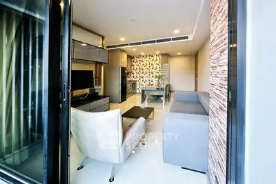 Modern open-layout living room with stylish furniture and sleek design