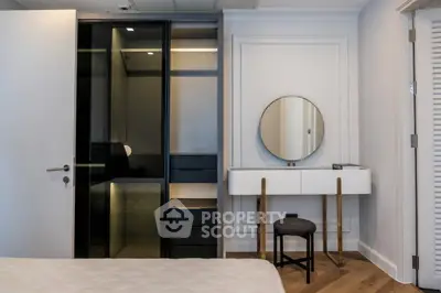 Modern bedroom with sleek wardrobe and stylish vanity area