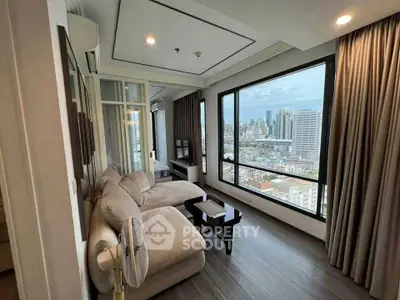 Modern living room with panoramic city view and cozy seating area.