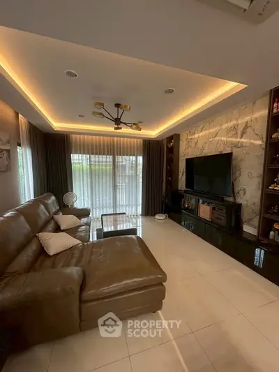 Luxurious living room with modern lighting and elegant leather sofa