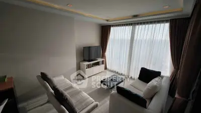 Modern living room with large windows and stylish furniture