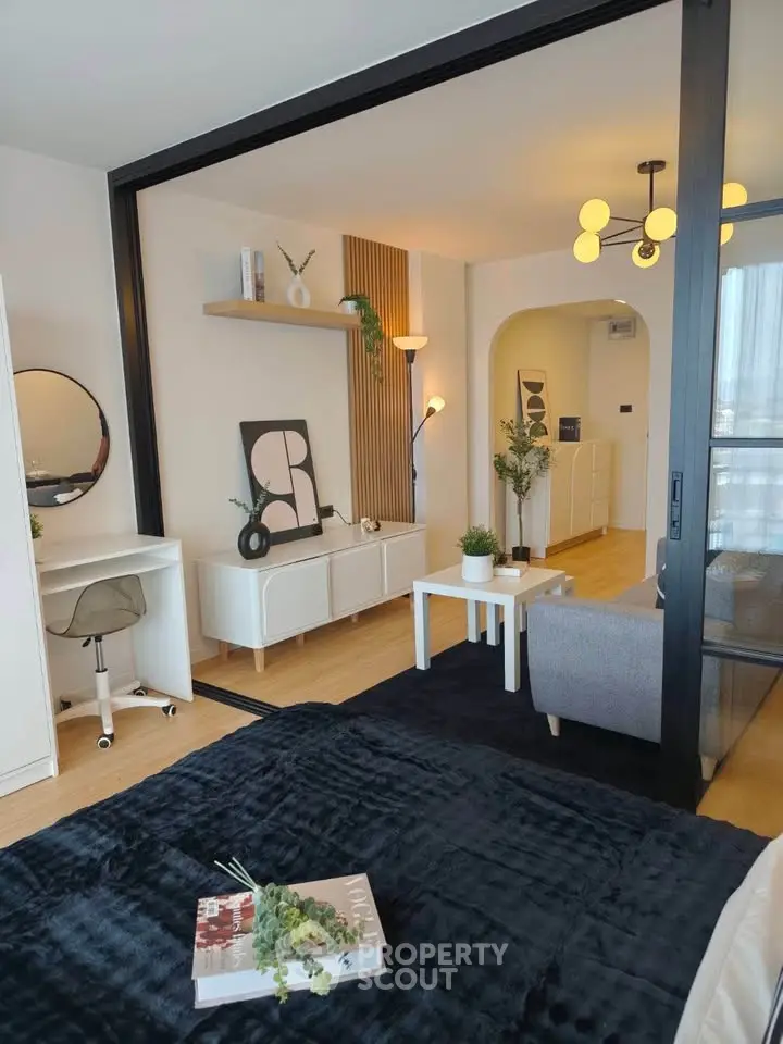 Modern living room with stylish decor and cozy ambiance, featuring sleek furniture and elegant lighting.