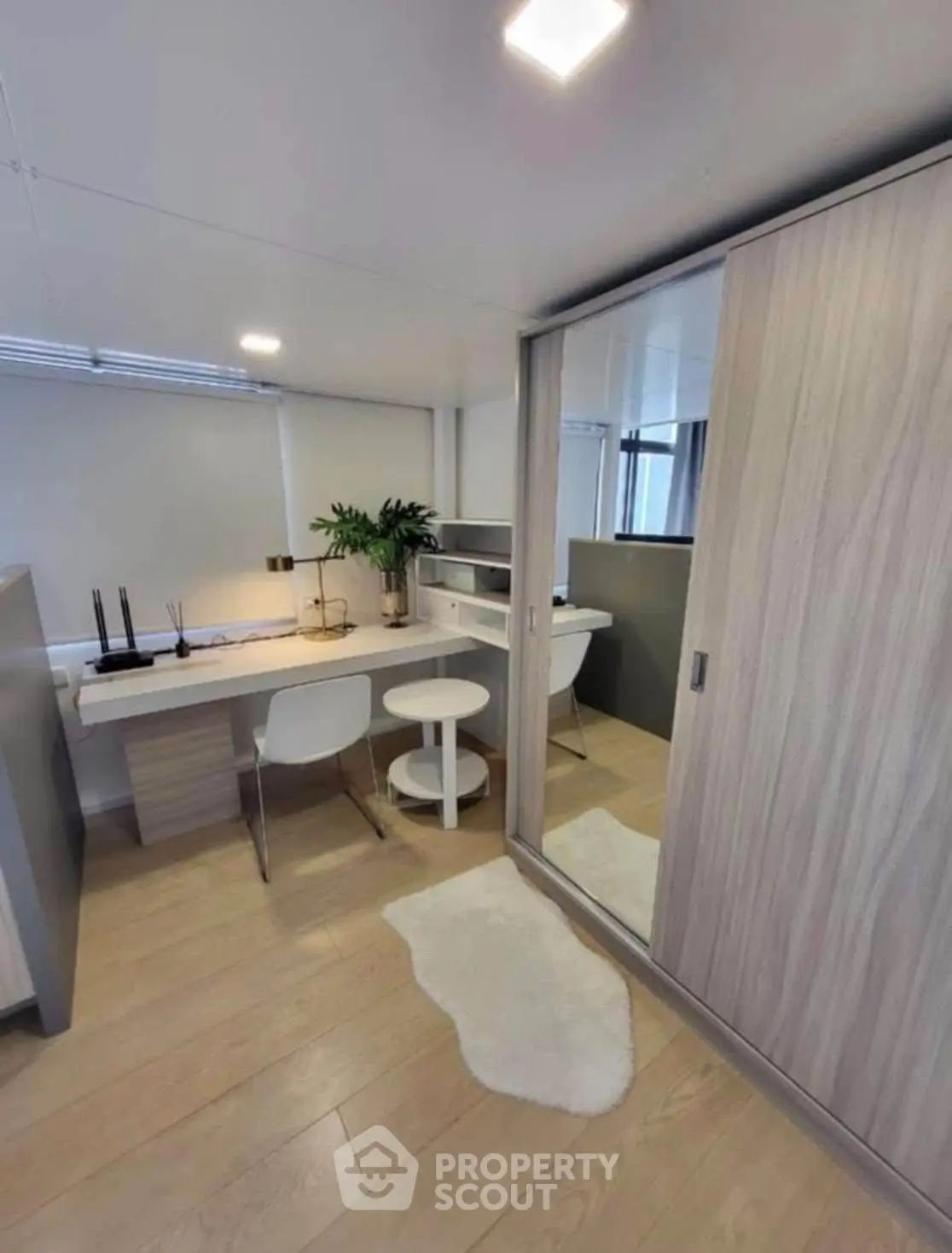 Modern study room with sleek furniture and ample natural light, perfect for productivity and comfort.
