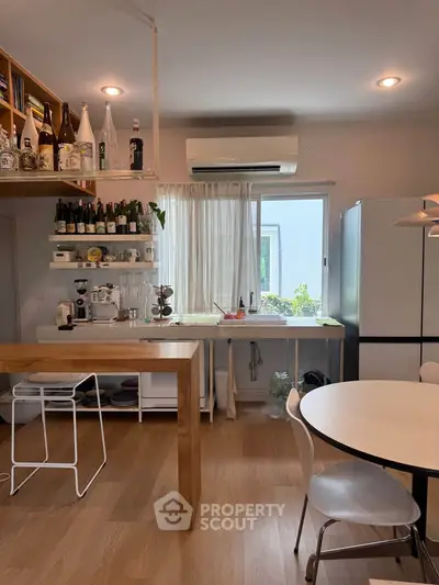 Modern kitchen with open layout, featuring sleek appliances and stylish decor, perfect for culinary enthusiasts.