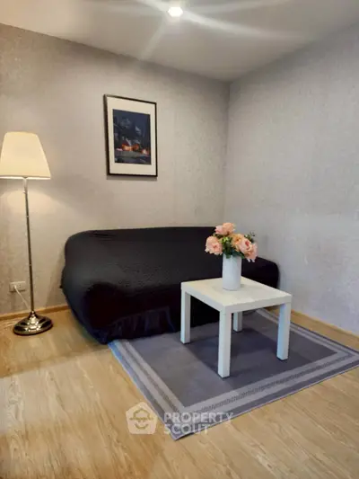 Cozy living room with elegant decor and soft lighting, featuring a stylish sofa and chic coffee table.
