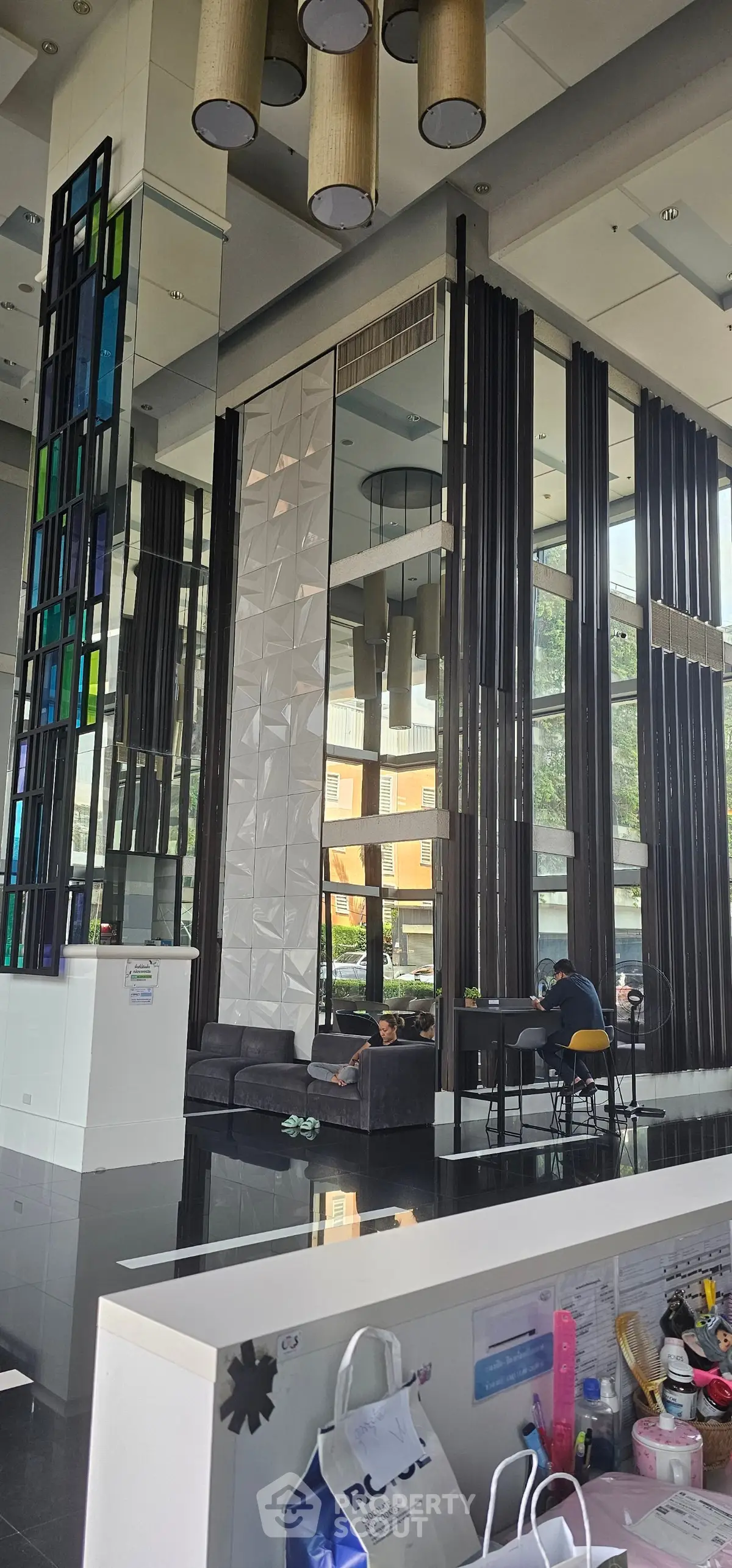 Modern building lobby with high ceilings and stylish decor