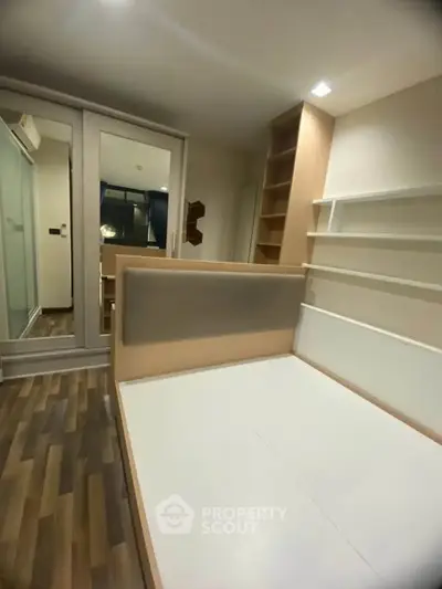 Modern bedroom with sleek design and built-in storage solutions