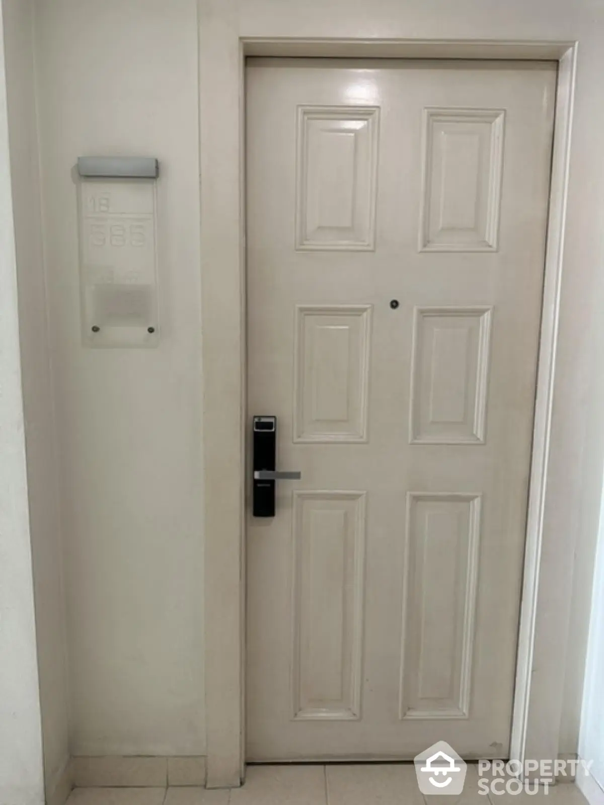 Modern apartment entrance with secure electronic lock and sleek design